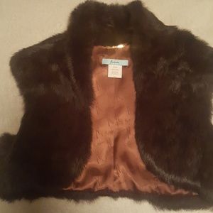 Very cute fur vest.  Will be great for the holiday
